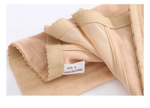 Detail of breathable mesh fabric and adjustable hook-and-eye closure on body shaper