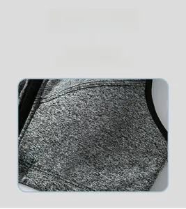 Detail of heather grey breathable knit fabric with black side zipper for sports bra