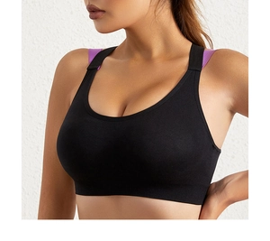 Detail of black sports bra with purple double straps and seamless elastic fabric