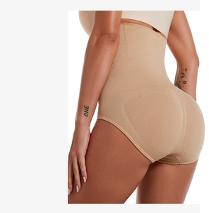 Side view detail of high waist beige shapewear pants showing butt lifting and tummy control