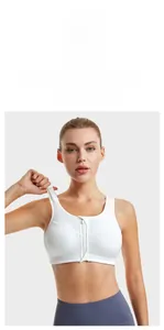 Detailed close-up of white sports bra with secure front zipper and wide straps