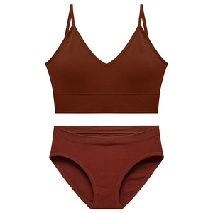 Sultry rust red V-neck lingerie set with ribbed knit texture and spaghetti straps