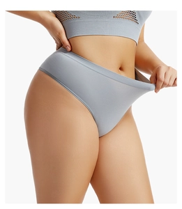 Detail showing high elasticity of seamless grey thong with soft stretch fabric for fitness