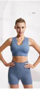 Detail of blue ribbed high-elastic sports bra featuring small U-neck design and soft fabric