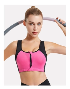Detailed close-up of a front-zipper sports bra in black and pink for high-impact workout