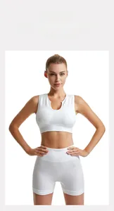 Detail view of white ribbed knit high-impact sports bra and high-waisted shorts set