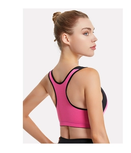 Detail of pink and black racerback sports bra showing breathable fabric and ergonomic fit