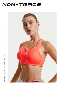 Close-up of front zipper closure and breathable mesh on neon orange sports bra