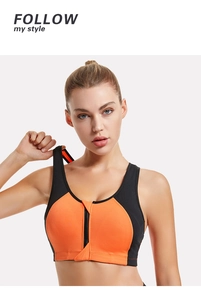 Detail view of high-impact sports bra with orange panels and black front zipper closure