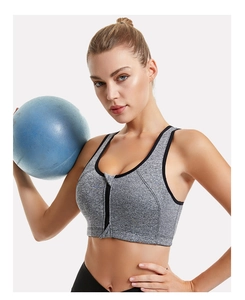 Detail view of grey heather sports bra with front zipper closure and black piping accents