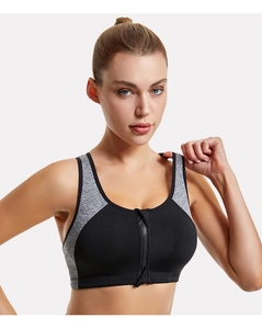 Close-up of women's sports bra featuring a convenient front zipper and bicolor design