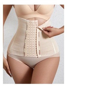 Detail of skin-toned waist trainer with six-row hook closure and breathable fabric
