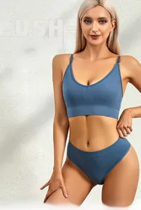 Detailed view of Morandi blue seamless V-neck lingerie set on model in minimalist setting