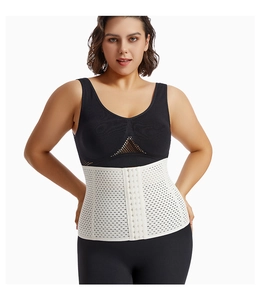 Detail of white waist trainer with breathable mesh fabric and multi-row hook closures