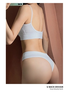 Detail of white ribbed knit fabric with seamless U-back design on supportive bra