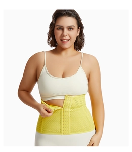 Detailed macro view of yellow waist trainer with breathable mesh and triple row hook closures