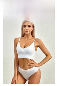 Detail view of white ribbed fabric lingerie set with slim straps on model profile