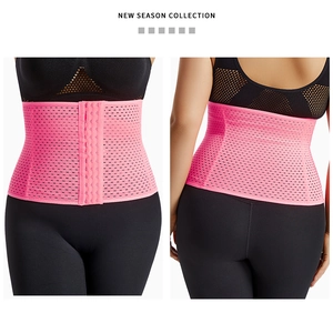 Detail of pink waist trainer with breathable mesh fabric and adjustable hook-and-eye closure