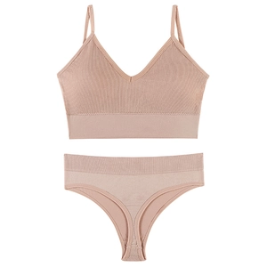 Seamless ribbed knit lingerie set in dusty pink featuring V-neck bra and matching thong