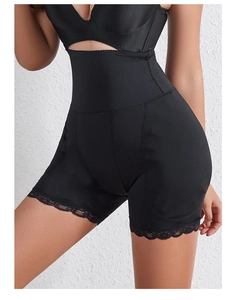 Detail of high waisted body shaper featuring black lace trim and elastic compression fabric