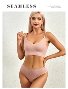 Detail of light pink seamless bra set featuring fine ribbed texture and V-neckline cut
