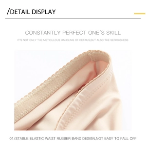 Detail of high elastic waist rubber band and scalloped edge on beige shaping shorts