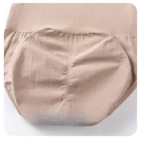 Close-up of nude tummy control bodysuit showing butt-lifting pleated fabric detail