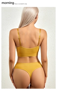 Rear view of ginger yellow seamless ribbed lingerie set with fine adjustable straps