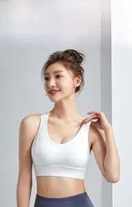 Detailed view of white wireless sports bra with wide straps and high-elastic fabric