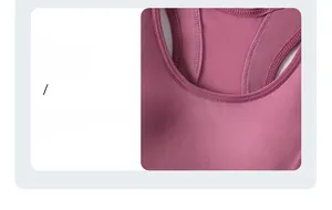 Detail showing the crew neck design and professional stitching on the dusty pink sports bra