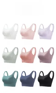 Detailed view of seamless sports bras in nine various colors with U-shaped neck design