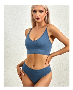 Detail view of seamless haze blue lingerie set with fine vertical ribbed knit texture