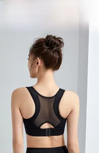 Rear view of black sports bra featuring breathable mesh splicing and racerback design