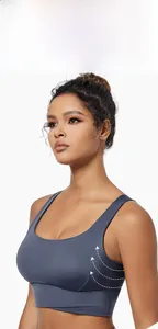 Detail of sports bra featuring wide straps and seamless compression for side support