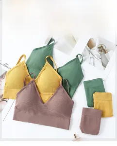 Flat lay of ribbed v-neck seamless bra sets in grey-brown, mustard, and dark green colors
