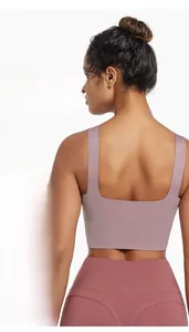 Detail of lavender sports bra featuring wide straps and a seamless straight back design