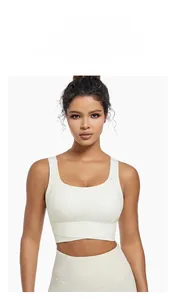 Detailed view of ivory white high-elastic seamless yoga set with cross-hem sports bra