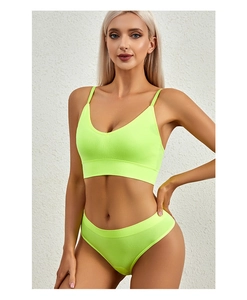 Close-up of fluorescent ribbed seamless lingerie set with thin straps and deep V-neck