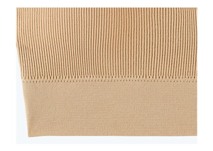 Detailed close-up of ribbed knit fabric and seamless hem stitching on the bra band