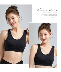 Detail view of black high-impact sports bra with wide straps and supportive fabric design