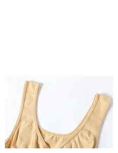 Detailed close-up of seamless beige shapewear bodysuit with U-neckline and wide shoulder straps