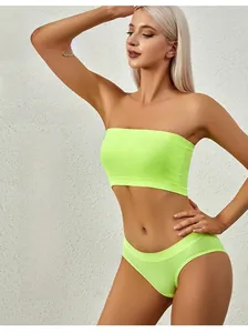 Detailed view of seamless neon green bandeau bra and matching high-stretch knit panty set