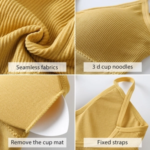 French seamless yellow sports bra with 3D cups, ribbed texture and removable pads