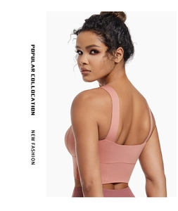 Detail view of mauve sports bra with wide straps and U-shaped back for yoga