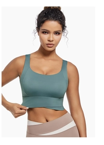 Close-up of flexible high-elasticity fabric on green high-impact sports bra