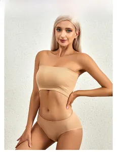 Detail of apricot seamless ribbed tube top bra and matching panties set for women