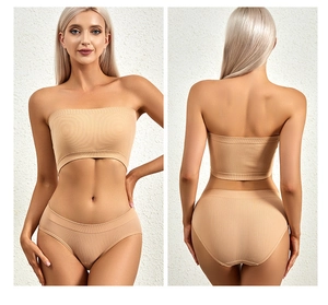 Detail view of seamless ribbed tube top bra and panty set in apricot for women