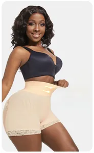 Detail of high waist tummy control shorts with elastic band and delicate lace trim
