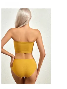 Detail of mustard yellow ribbed knit bra and panty set showing seamless textured back