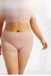 Detail of high-stretch seamless high-waisted safety shorts in soft nude pink fabric